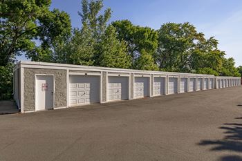 A long row of garage doors are closed.